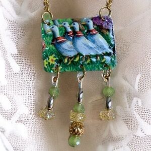Mixed media artisan necklace. Made from a toffee tin. Sweet geese parade in park